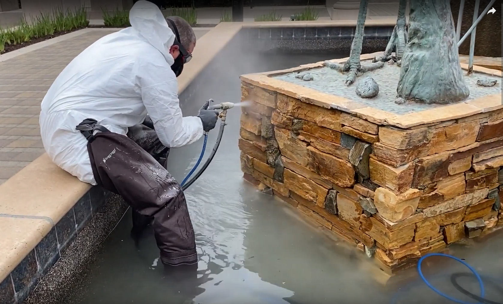 Using the Pool Master to abrasive blast a fountain in Folsom, California