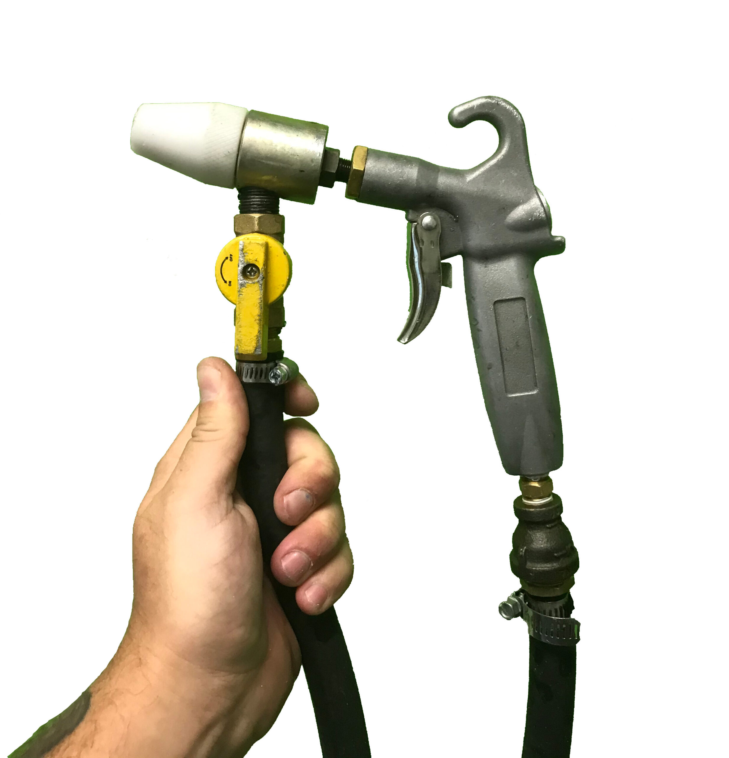 Hand holding blast nozzle